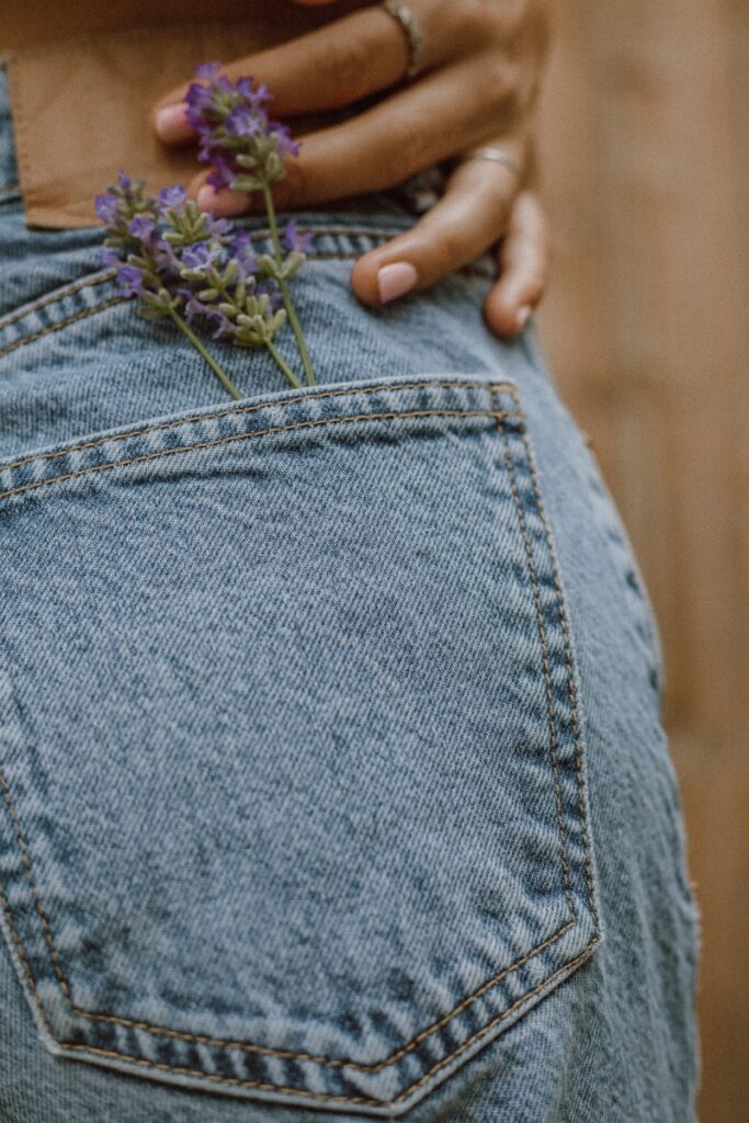 person in blue denim jeans